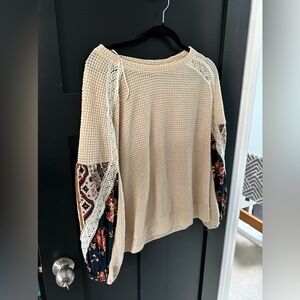 Adorable sweater with cute sleeve detail!